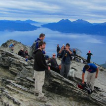 Crowded summit of Cerro Guanaco with Beagle Channel in the background